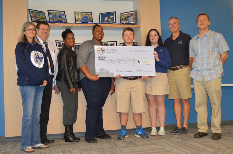 Shown are (l-r) Anna Moshier, parent volunteer; Marc Cooke, SGA advisor; Renee Hickman, Boys & Girls Club of Georgetown; Adrianna Harris, Boys & Girls Club of Georgetown; Cohen Davis, Sussex Academy 11th-grade student; Micaela Reyes, Sussex Academy 11th-grade student; Allen Stafford, Sussex Academy administrator; and Craig Klasic, parent volunteer. SOURCE SUBMITTED