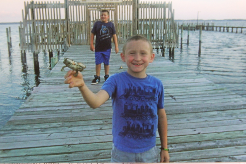 Nathan Leppo, 7, proudly holds the first crab he caught. COURTESY MARTHA SEXTON