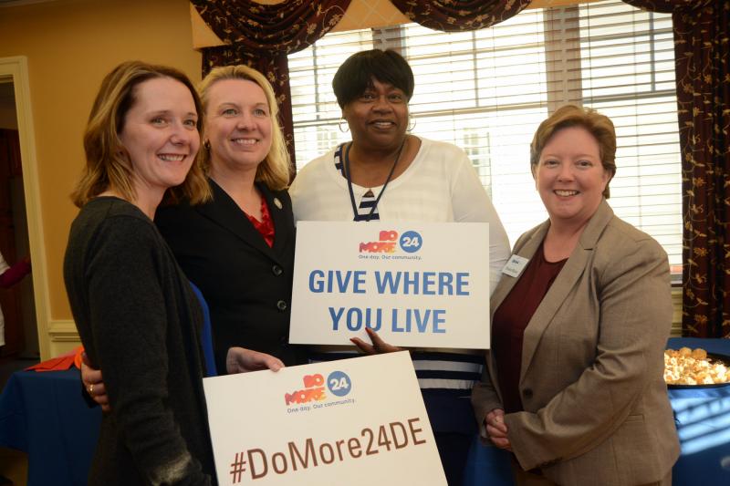Community partners (l-r) Amy Walls, Discover Bank; Peggy Geisler, Sussex County Health Promotion Coalition; Bernice Edwards, First State Community Action Agency; and Sheila Bravo, DANA promote the Do More 24 Campaign. BY STEVEN BILLUPS