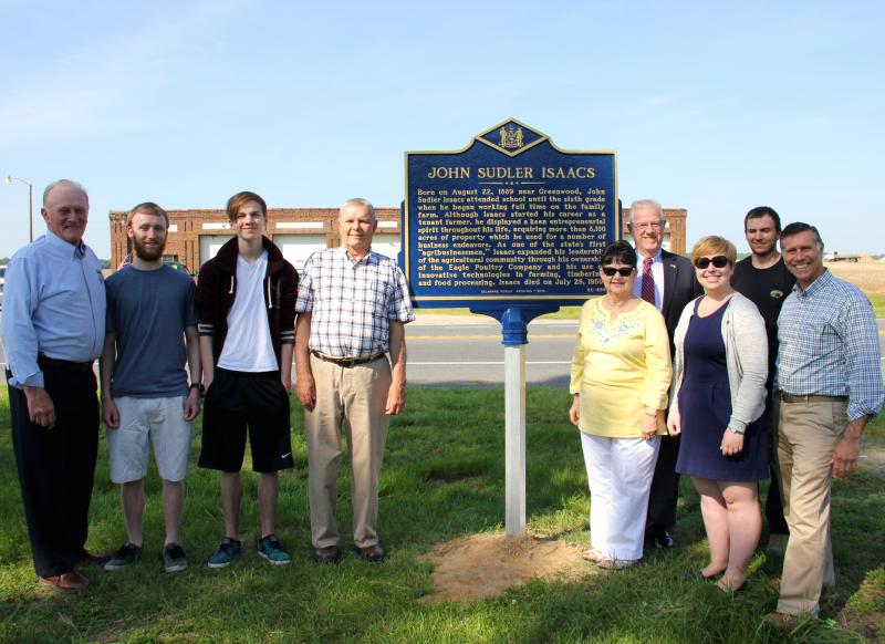 On hand for the unveiling of the marker are (l-r) Rep. Dave Wilson, Ryan Wells and Garrett Whitney, great, great grandsons; Hobby Isaacs, grandson; Hilda Isaacs Lankford, granddaughter; Rep. Harvey Kenton, Delaware Public Archives Deputy Director Sarah Denison, Hunter Whitney, great-great-grandson; and Rep. Steve Smyk. BY DENNIS FORNEY