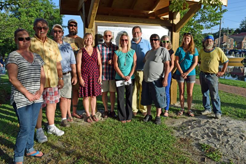Celebrating Milton's new kiosk are (l-r) Jessica Hammond of The Nature Conservancy, Milton councilmen Charlie Fleetwood and Kevin Kelly, Dogfish Head's Mark Carter, Maria Dziembowska of The Nature Conservancy, Milton Mayor Ted Kanakos, Milton Town Clerk Kristy Rogers, Milton councilmen Michael Coté and Emory West, and The Nature Conservancy staff members Pam Sapko, Natasha Whetzel and John Graham. MADDY LAURIA PHOTO
