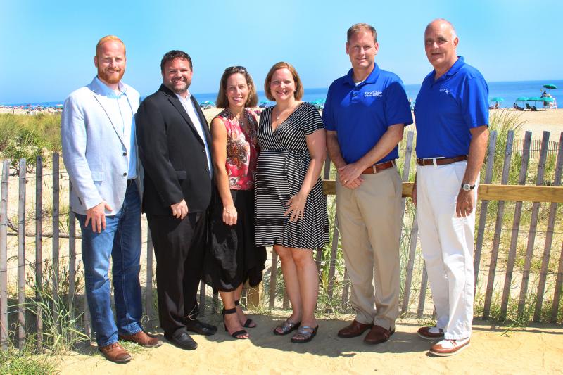 Shown are (l-r) Paul Richardson, Keller Williams; Matt Fetick, Keller Williams CEO and team leader; Brigit Taylor, Keller Williams team leader; Jamie Wells, ResortQuest area general manager, rentals; Patrick Davis, Wyndham/ResortQuest vice president, Mid-Atlantic; and Tom Olson, ResortQuest area general manager, property management. SUBMITTED PHOTO