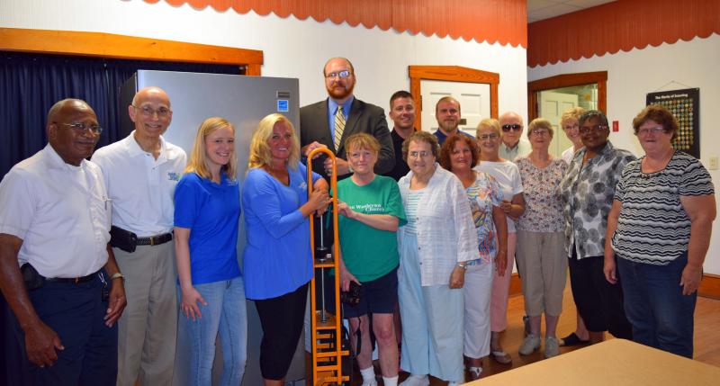 Insight Homes staff and Milton Community Food Pantry volunteers show off a brand-new freezer. In back are (l-r) Insight staff Zachary Jahnigen, Kyle Short and Josh Hoinowski. In front are Insight staff and food pantry volunteers Manchester Brisco, Tom DiOrio, Kat Angus, Ginger Yocus, Joan Dotterer, Elaine Brown, Paula Costanzo, Marge LaFond, Bob Dotterer, Barbara Wright, Nancy Trask, Jackie Brisco and Christy Robinson. MADDY LAURIA PHOTO
