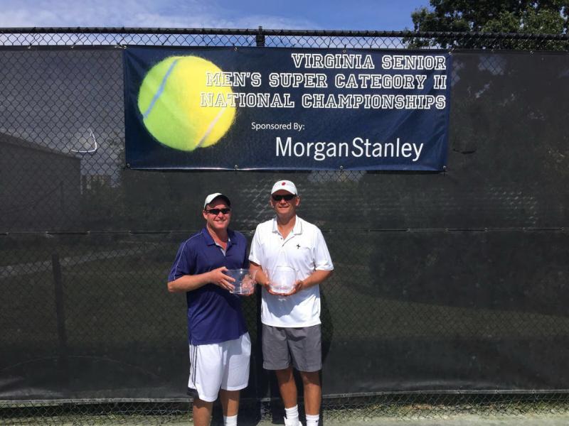 Ellis Ferreira, left, and Dr. Dave Marshall are shown with their prizes as winners of the National Men's 45 Clay Court Doubles Championships. SUBMITTED PHOTO