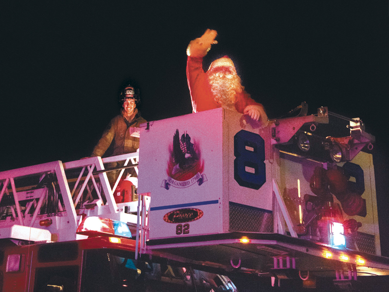 Santa waves to the crowd during the 2015 Lewes Christmas Parade. SUBMITTED PHOTO
