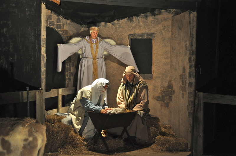 The birth of Jesus in the manger is portrayed in this scene with Stephanie Whitcomb as Mary, Bryan Whitcomb as Joseph and Lynn Marslett as the angel. This year’s living nativity is set at Conley’s UMC Dec. 16 and 17. RON MACARTHUR PHOTO