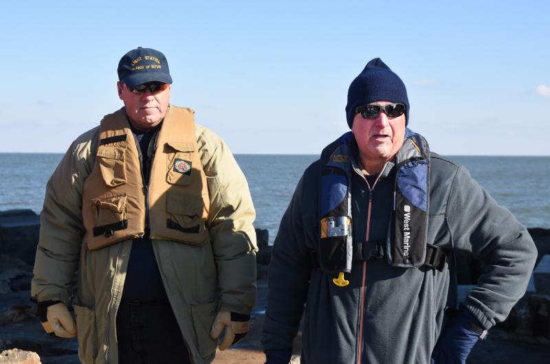 Foundation President Red Moulinier discusses the recent project to build a new dock at the Harbor of Refuge Lighthouse. Standing behind is board member Garrett Coleman. NICK ROTH PHOTO