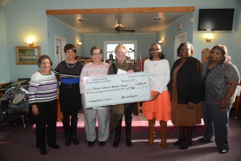 Shown at the check presentation at Israel United Methodist Church, prior to its Jan. 29 Sunday service, are (l-r) Carolyn Morris, Miracle Angels; Shorel Clark, Friendship United Methodist Church; Betty Streett, Miracle Angels chair; Cherrie Rich, executive director of Oncology Services at Tunnell Cancer Center; Joyce Rickards, Freindship United Methodist Church; the Rev. Marjorie Belmont-Burns; and Lorie Hopkins, Miracle Angels. Patient Specials Needs