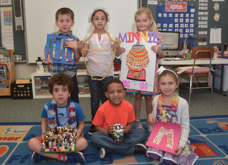 Shields students display their first 100 days of school projects. In back are (l-r) Edward Hale, with 100 Legos; Vanille Hixon, 100 pieces of macaroni to make a necklace; and Minnie Pettengell, 100 gumballs. In front are (l-r) Ransom Cole, 100 Star Wars Lego characters; Tyson Johnson, 100 small pom pom balls; and Alyssa Flamini, 100 Smarties.