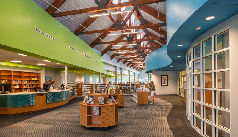 The Lewes Public Library interior features exposed wood trusses and extensive natural light provided by a central spine of clerestory windows. SUBMITTED PHOTO