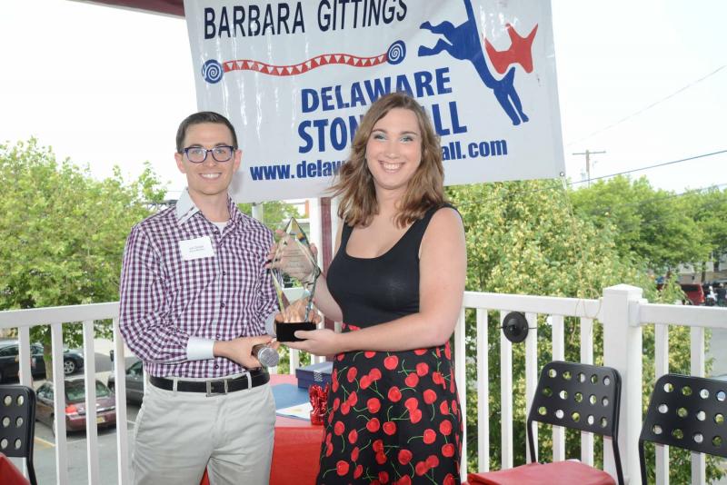 Joe Daigle, Delaware Stonewall Democrats president, presents Sarah McBride with the 2017 Trailblazer Award. McBride spoke to gathered crowd saying “In fact, Delaware is the only state in the nation that passed two major pieces of LGBT equality legislation in one session.” She went on to say “Delaware is one of only five states that has Democrats in control of the both chambers of the Legislature of the state and a Democratic governor. We can and should be and are on the front lines of the resistance and the front lines of this movement for equality, and that should continue moving forward.” Stonewall Democrats