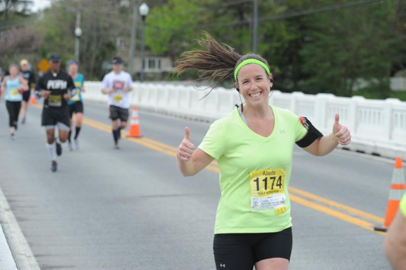 Alida Torres, a Cape and University of Delaware graduate, rocks happy crossing Silver Lake bridge during the CoDel Half Marathon. The bridge connects south Rehoboth to Dewey Beach. Alida is a physical therapist at Elite Fitness on the Boardwalk and one of her clients is Dr. Dave Robinson, former Cape superintendent. Silver Lake is just one of the beautiful vistas of Cape Henlopen. DAVE FREDERICK PHOTO
