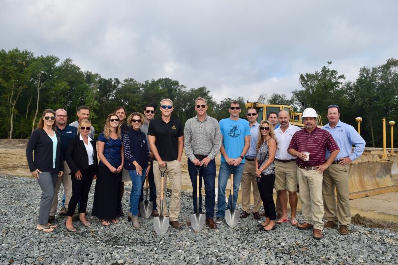Breaking ground on Carillon Woods are (l-r) Sarah Dutton of Ocean Atlantic; John Russ of the Whayland Company; John Wilson of Whalen; Jax Corrado of Ocean Atlantic; Jill Burton of Ocean Atlantic; Tony Namow of Ocean Atlantic; Lauren Moore of Ocean Atlantic; Roger Chaufournier of Ocean Atlantic; Chris Schell of Schell Brothers; Preston Schell of Ocean Atlantic; Dustin Berlinger of Schell Brothers; Zac Crouch of Davis, Bowen and Friedel Inc.; Jaime Zolper of Ocean Atlantic; Jamie Sechler of Davis, Bowen and Friedel Inc.; Greg Tobias of Ocean Atlantic; Scott Fowler of A.P. Croll & Son Inc.; and Tom Tipton of Ocean Atlantic. Carillon Woods owners are shown with the shovels. MADDY LAURIA PHOTOS