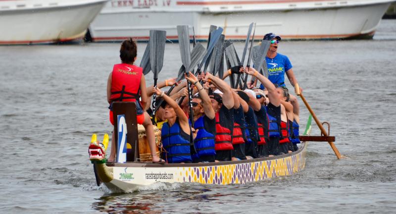 Schell Brothers Fire Breathers raise their paddles after winning the fifth and final Lewes Dragon Boat Festival Sept. 17 on the Lewes-Rehoboth Canal. RON MACARTHUR PHOTOS
