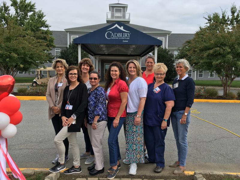 The organizers and staff of the walk gathered early for a photo. Shown in back are (l-r) Carol Cascone, marketing coordinator; Barbara White, executive assistant; and Lauri Weeks, director of resident services. In front are Dee Gorsuch, activity director; Tina Foskey, assisted living admissions coordinator; Tara Millman, social worker; Karen Kerstetter, director of marketing; Beth Seeds, staff educator; and Carol Holzman, executive director. Cadbury Heart walk