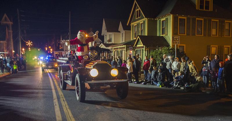 During a previous parade, Santa flew into Milton atop a 1926 American La France fire truck courtesy of the Milton Fire Department. DENY HOWETH PHOTO