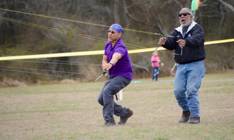 Jim Cosca of Fort Washington, Md., left, and Dennis Williams of East Brunswick, N.J., perform a stunt kite-flying demonstration March 30 during the 50th annual Great Delaware Kite Festival at Cape Henlopen State Park. RON MACARTHUR PHOTOS