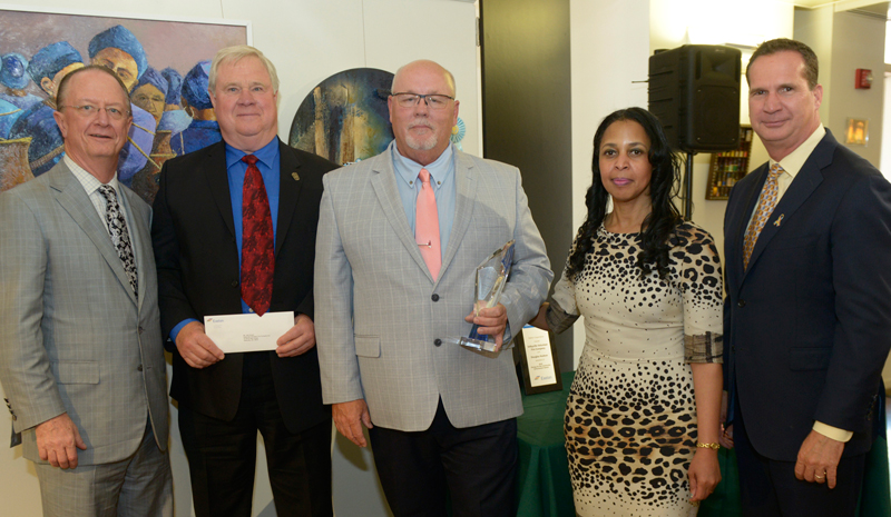 Delmarva Power’s Doug Hudson, engineering fieldman first class, was recognized for his volunteer work with the Selbyville Volunteer Fire Co. Shown are (l-r) Exelon Senior Executive Vice President & Chief Strategy Officer William Von Hoene, Selbyville Volunteer Fire Co. Vice President Howard Pepper Jr., Hudson, Pepco Region President Donna Cooper, and Pepco Holdings Senior Vice President & COO Tyler Anthony. SUBMITTED PHOTOS