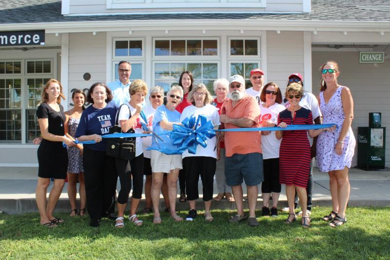 Ribbon-cutting attendees shown are (l-r) Lisa Newnom and Sophia Sawicki, Rehoboth-Dewey chamber; Linda Darr; Sen. Ernie Lopez; Carol Simon; Adele Jones; Mary Helms, ALS patient; Lauren Doberstein; Kitty Wilkin, ALS patient; Joyce Paugh; John Wilkin; John Gauger; Mary Lou Anicola; Carol Everhart, chamber president and CEO; Nichelle Hill; and Meghan McCalley, chamber. SUBMITTED PHOTO