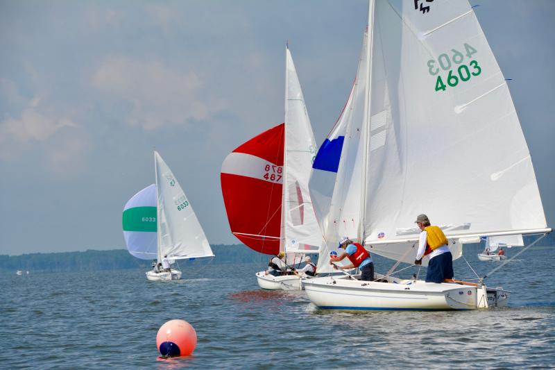 Sailing under 4603, Debbie Cycotte, skipper, and Mosby West of Hartfield, Va., round a mark and prepare to hoist their spinnaker.