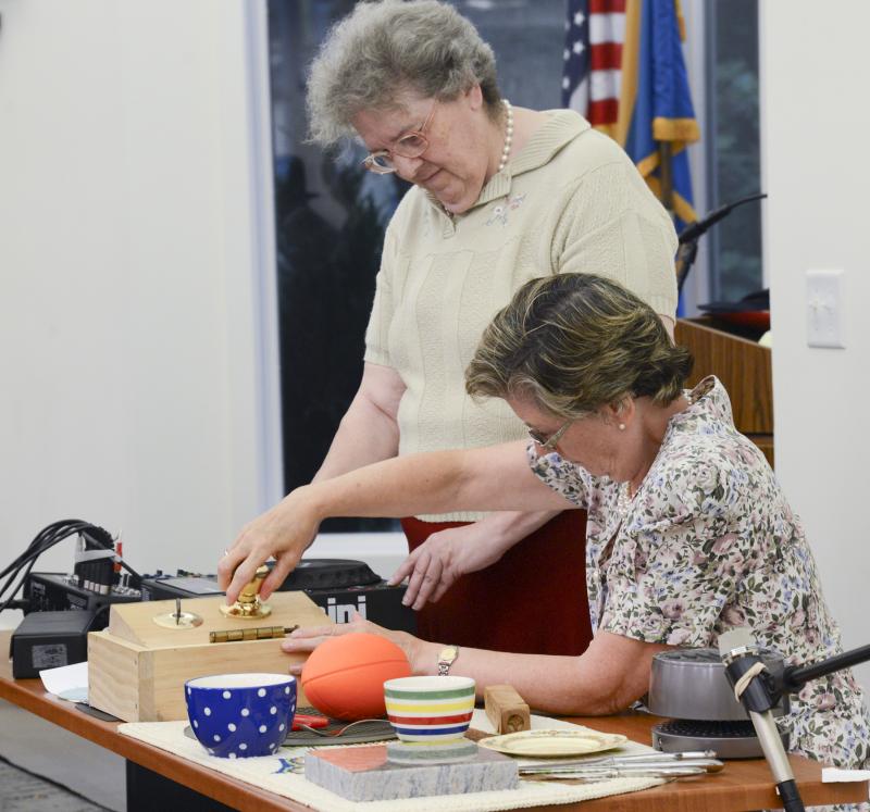 The sound tech team (l-r) Joanie Adkins and Kathy Ackerman, open the door during the Possum Point Players’ old time radio show.