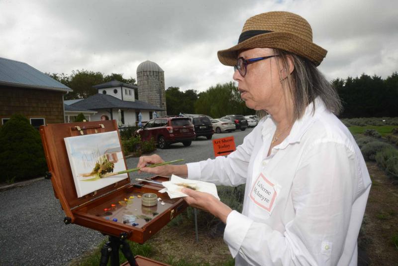 LaVerne McIntyre from Lewes paints during the Autumn Splendor event. Autumn Splendor