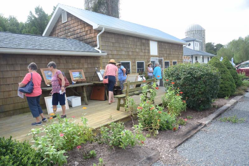 Visitors browse the art on a pleasant Autumn Splendor day. Autumn Splendor