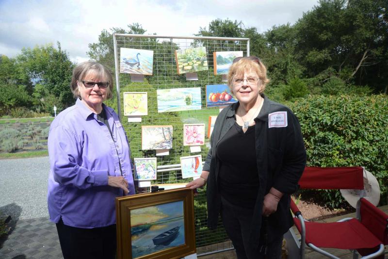 Lavender Fields co-owner Marie Mayor joins Linda Minkowski at her art display for a photo. Minkowski taught most of the artists in the Delaware Shore Artists Group. Autumn Splendor
