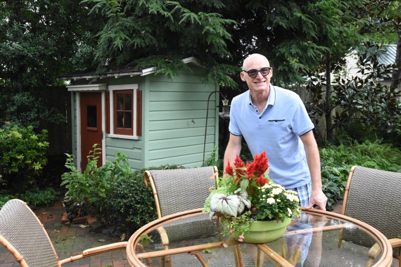 Brian King poses for a photo in his back yard.