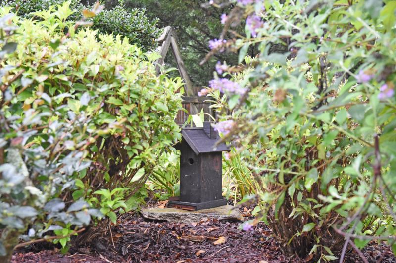 This birdhouse hides in the middle of the garden of Jeanette Boyer.