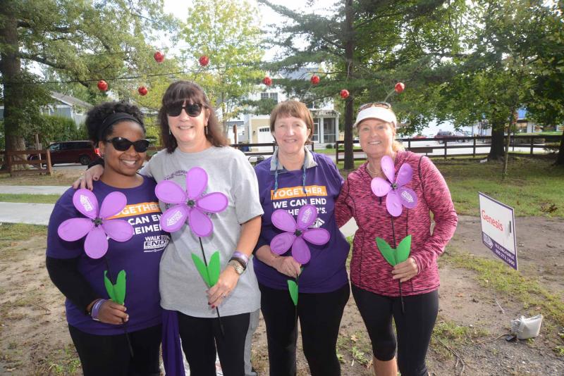 Carrying purple flowers signifying someone who has lost a loved one to Alzheimer’s are Team CJ. Shown are (l-r) Candice Buchanan, Amelia Hodges, Deb Stevens and Susan Brady. Walk to End Alzheimers