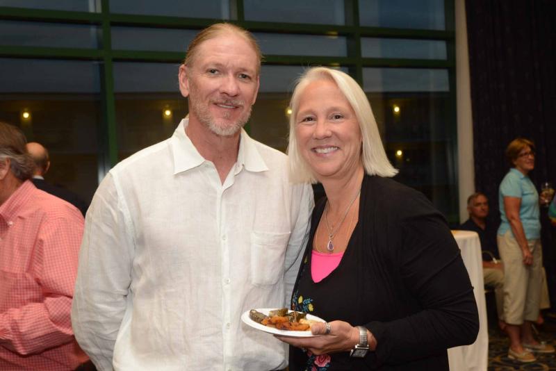 Volunteer Jim Hukill, left, shares a moment with patron Stacey Maloney. All Saints’ Celebration 2018