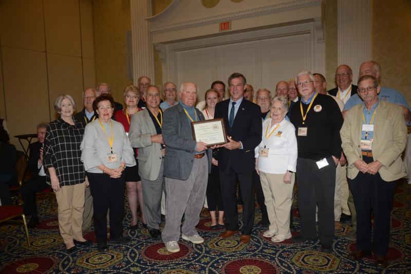 In the last 15 years, the Fort Miles Museum volunteer group has grown from four to nearly 400 volunteer members who work within several layers of volunteerism, all focused on sharing the rich history of Delaware’s role in the coastal defense. Shown receiving the award, surrounded by several of the volunteers, is Fort Miles Historical Association President Dr. Gary Wray, left, with Gov. John Carney. Volunteer Awards