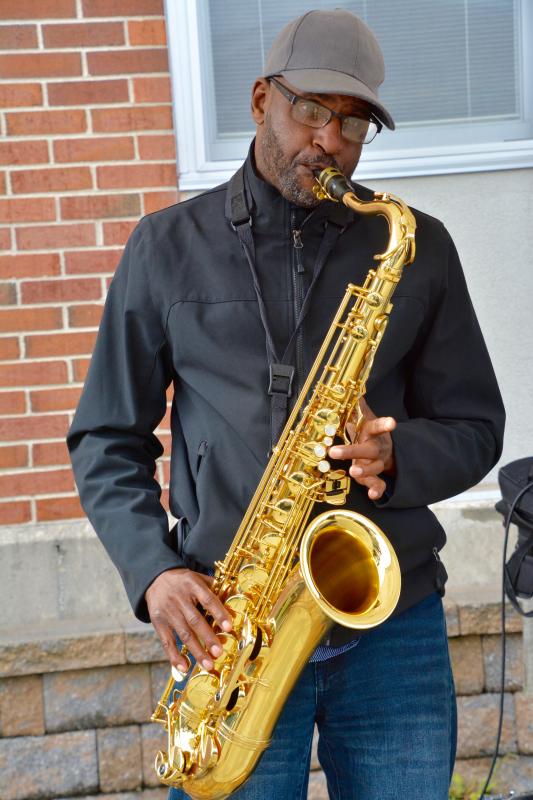 Reggie Harris braves a chill in the air to bring jazz to the Historic Lewes Farmers Market. RON MACARTHUR PHOTO