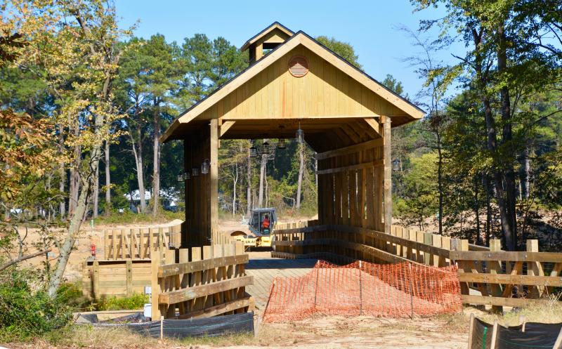 The area’s first and only covered bridge will serve as the entrance to Covered Bridge Trails off Tulip Drive in Lewes. Site work on the housing project is underway. RON MACARTHUR PHOTO