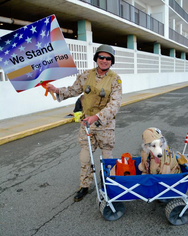 Hero, a 15-year-old Australian shepherd, gets a ride from his owner, Rick Tedrick of Rehoboth Beach. Tedrick was picked as a prize winner by the judges. RON MACARTHUR PHOTO
