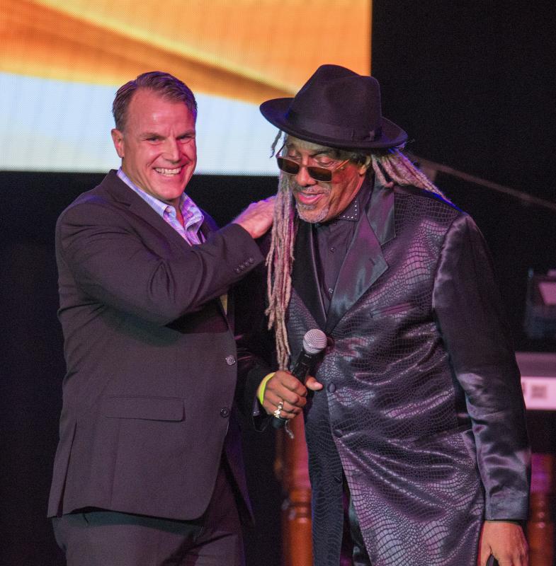 Cape Superintendent Robert Fulton welcomes Emcee Perky Scott and the crowd to the theater at the opening of the Jazz Festival Oct. 11 at Cape Henlopen High School. DENY HOWETH PHOTO