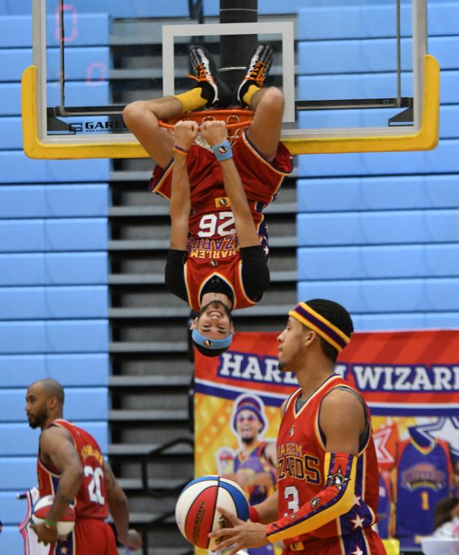 Harlem Wizards’ high-flying dunker Hang Time aka Jordan Hoose finds a place a to hang out during the event.