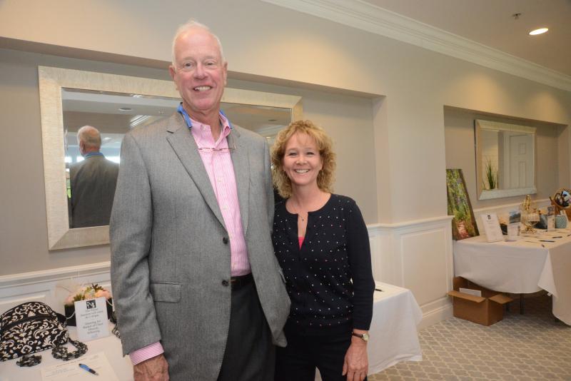 Board member Allen Atzrott and CFO Michelle Burris take a break from the silent auction table for a photo. Delaware Hospice Brunch