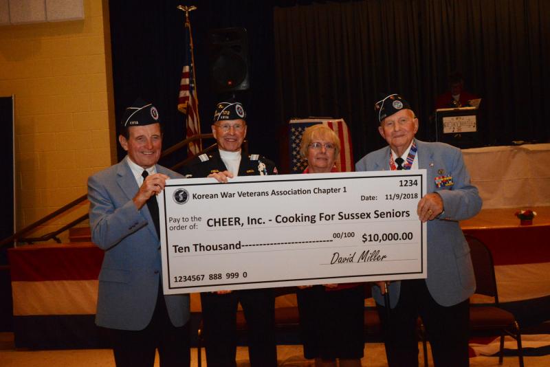 During the ceremony, the Korean War Veterans Association, Chapter 1 presented a check to CHEER for its kitchen capital campaign called Cooking for Seniors. Shown are (l-r) Ed Johnson, Delaware commissioner for KWV Affairs; Jack McKinley, president of KWVA Chapter 1; Joyce Weston, CHEER chief administration officer; and David Miller. CHEER Veteran Day