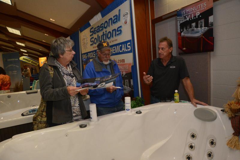 Seasonal Solutions brought its spas to the expo and drew a lot of attention. Shown around the spa are (l-r) Janet and Bob Cosgrove, and Seasonal Solutions owner and Manager Steve Wallo. Resort Home Fall Expo
