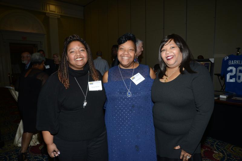Members of the Delaware Fatherhood Coalition (l-r) Kesha Shields, Kenya Alston and Kim Brown take a break from their volunteer duties. FSCAA 53rd Anniversary