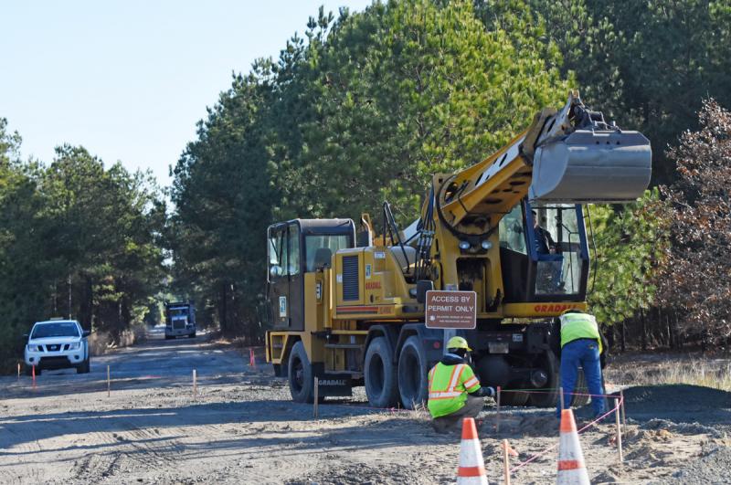 Crews work near the trail crossing at Freeman Highway. NICK ROTH PHOTO