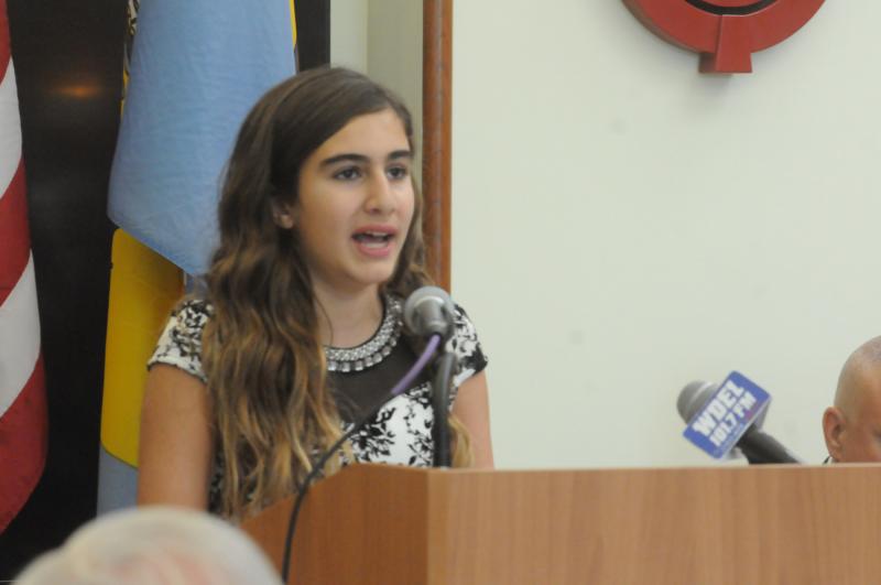 Rehoboth Beach resident Sara Freih sings the state song, “Our Delaware,” at the opening of the ceremony. American Illustrative Collection
