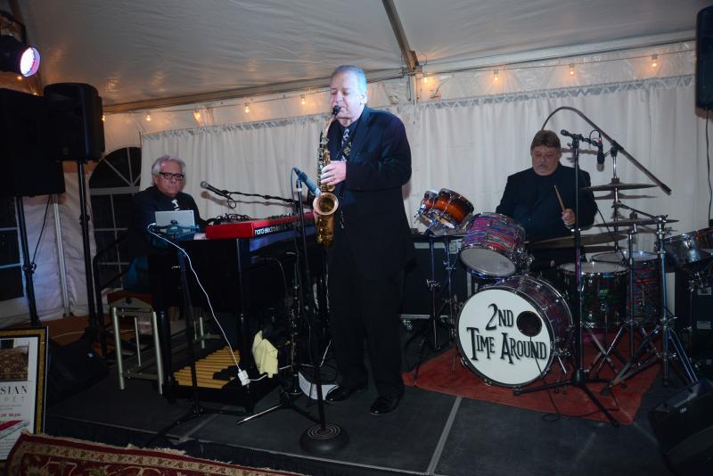 2nd Time Around kept the music playing throughout the evening. Shown are (l-r) Bob Yesbek, Ken Cicerale and Ken Schleifer. Children’s Beach House Winter White
