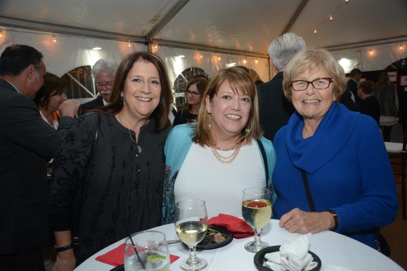 Friends enjoying the evening are (l-r) Melodie Billman, Julia Olmedo and Children’s Beach House volunteer Zita Millchap. Children’s Beach House Winter White