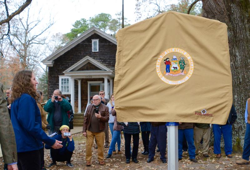 With Rabbit’s Ferry community center in the background, a historical marker is ready to be unveiled.