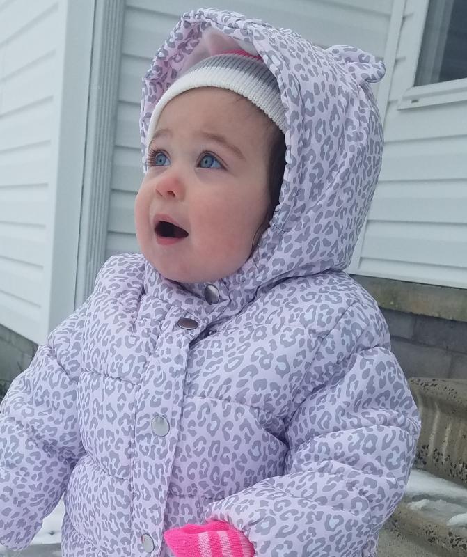 Logan Mae Harper of Georgetown reacts to seeing snow for the first time.