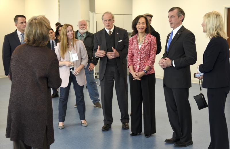 Colleen Davis, Sen. Tom Carper, Sen. Lisa Blunt Rochester, Gov. John Carney and Lt. Governor Bethany Hall-Long share laughs in one of the open plan therapeutic rooms.