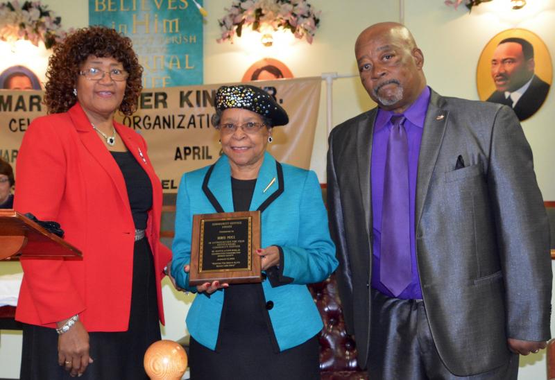 Delores Price, center, is presented with the Martin Luther King Jr. Celebration Organization Community Service Award by the Rev. Annie Custis, St. John 2nd Baptist Church, left, and Clem Jordan, organization president.